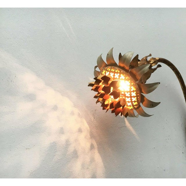 Imposing mid century wall lamp from Italy. Rarely wall lamp with floral ornamentation. The lamp is made entirely of metal....