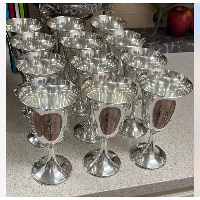 Set a 12 solid sterling silver unweighted goblets by Gorham pattern 272 with old English style L monogram. Set the perfect...