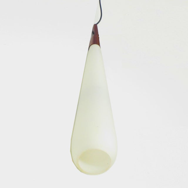 Large vintage mid century modern drop pendant lamp made of opal glass and teak from the 1950s - 1960s. Scandinavian design...