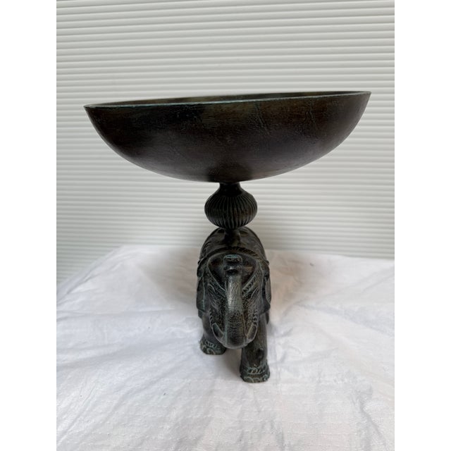 Design Plus Gallery presents an Elephant Jardinière in Bronze. The amazing piece has a base stand in the form of an...