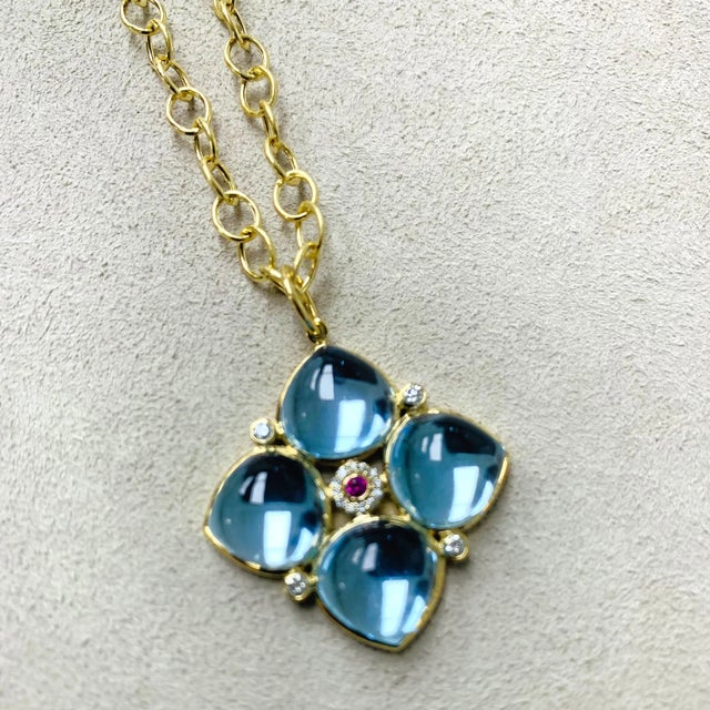 Created in 18 karat yellow gold Blue topaz 31 carats approx. Ruby 0.05 carat approx. Diamonds 0.20 carat approx. Chain...