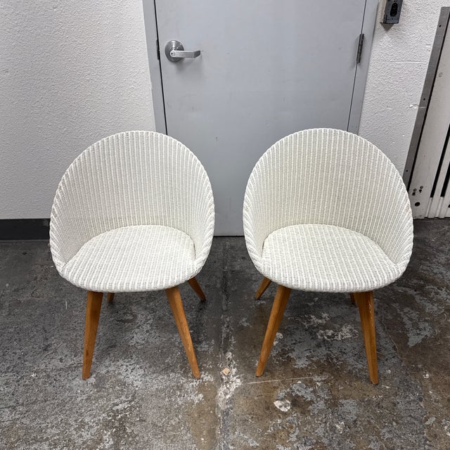 Design Plus Gallery presents a pair of Avril Dining Chairs from Vincent Sheppard. Each chair has a rounded Lloyd Loom...