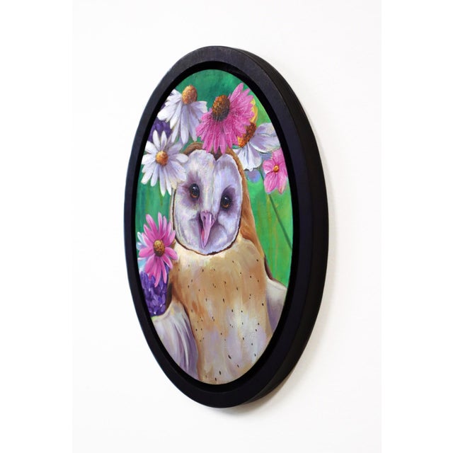 This artwork features a charming barn owl surrounded by a vibrant array of flowers, creating a harmonious blend of nature...