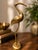 Add timeless elegance to your home with this vintage handcrafted brass crane sculpture made in India. Standing 16.75...