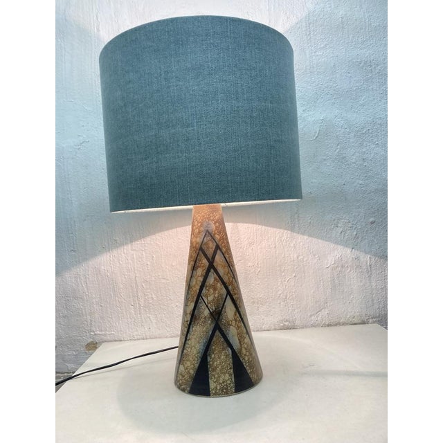 Large table lamp from the 1970s or 80s. Brand name present, but unidentifiable. Ceramic, fabric. Good used condition....