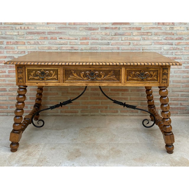 19th French Hand Carved Oak Wood Solomonic Leg Table Desk with Iron Stretcher. This antique French hand carved oak wood...