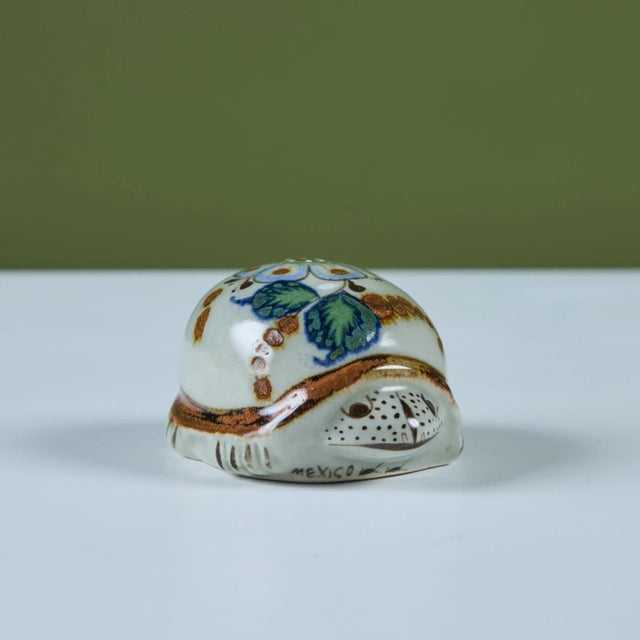 Hand painted ceramic turtle with floral motif on its back. Made in Mexico. Dimensions 4" width x 3" depth x 2.5" height....