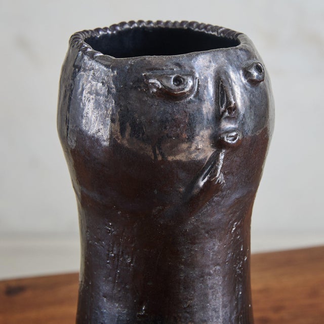 A hand-sculpted ceramic vase signed by the French ceramicists Dalo. Crafted from black iridescent glazed ceramic, the...