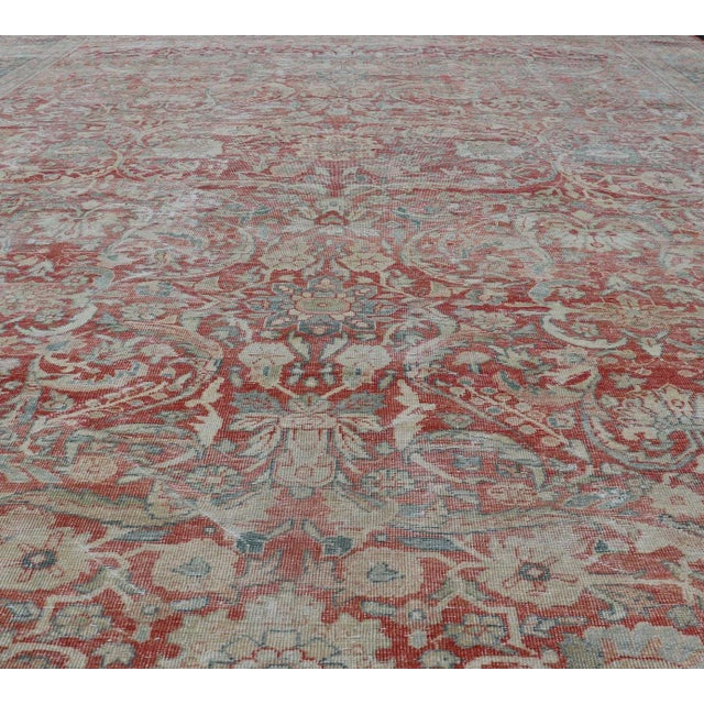 Distressed antique Persian Sultanabad rug in faded colors. Sultanabad Mahal antique rug from Persia with all-over...