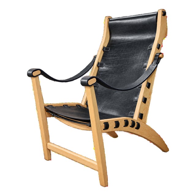 Celtia Black Leather and Solid Wood Lounge Chair For Sale