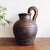 Vintage wooden pitcher with woven rattan handle, made in the Philippines. This pitcher is made of thick, solid hand-carved...