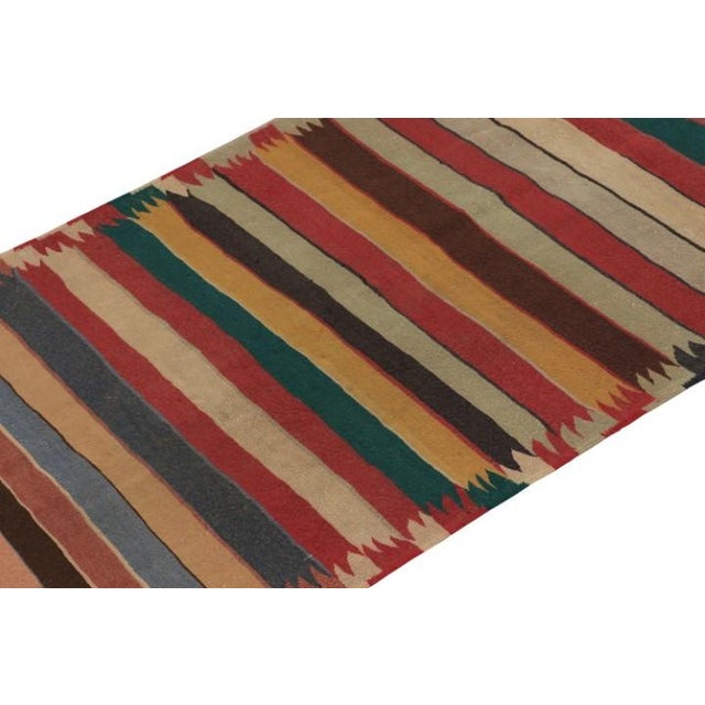 This vintage 4x11 Shahsavan kilim is a unique tribal rug for its period and provenance. Handwoven in wool, it originates...