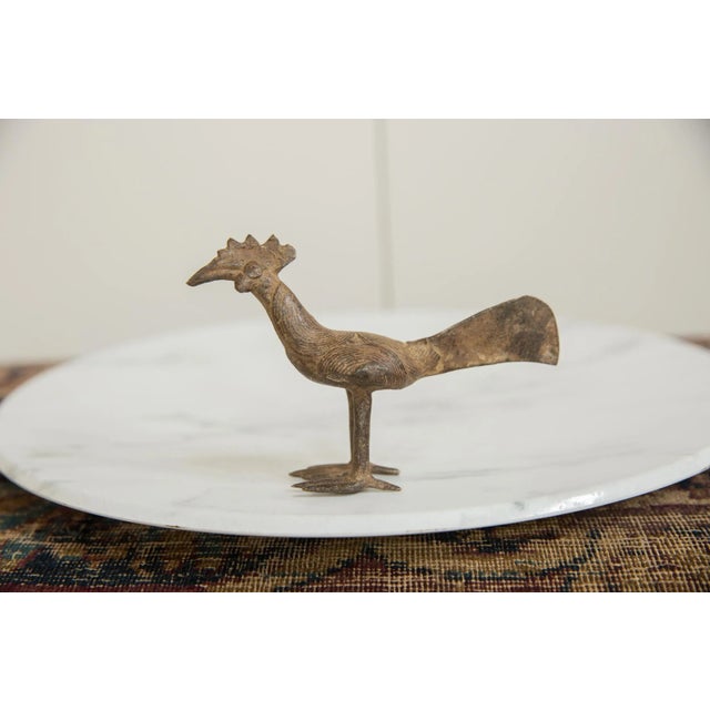 :: Vintage handmade African bronze long tailed bird. Circa mid 20th century and possibly older, this piece has such...
