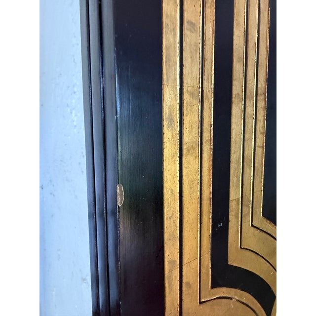 This is a stunning three panel floor screen or room divider, attributed to storied manufacturer Maitland Smith. It is...