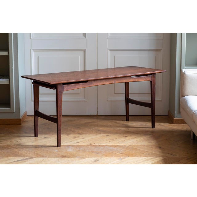 The coffee table has been professionally restored. The sliding shelf is highly practical and extends the functionality of...