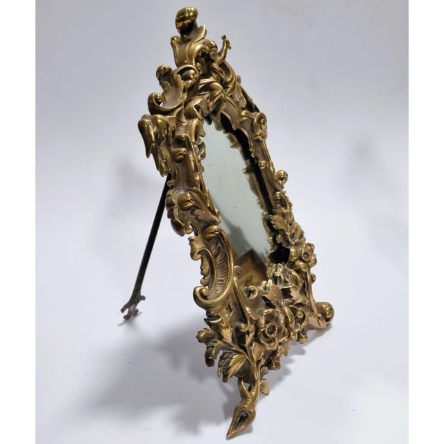An exquisite late 19th or early 20th-century antique table mirror designed in the opulent Baroque (or Neo-Baroque/Rococo...