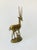 A large vintage brass gazelle with its baby. Beautiful gold patina and details formed into the brass.