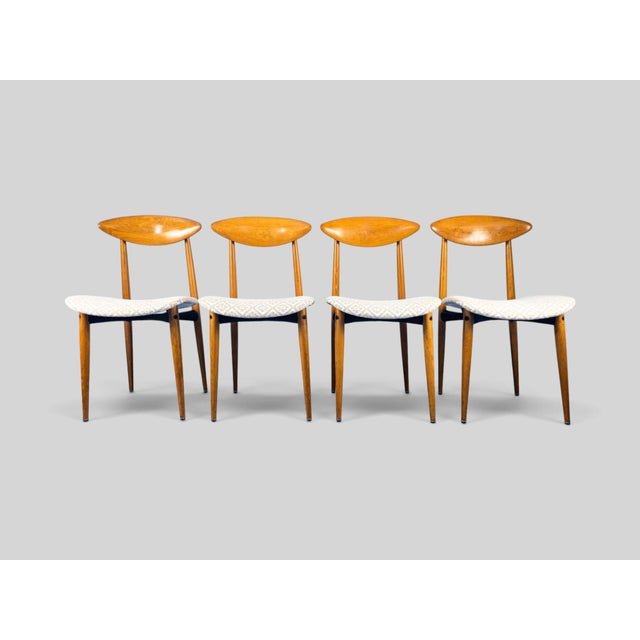 "This elegant set of four Italian dining chairs, produced during the 1960s, combines clean Scandinavian-inspired lines...