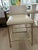 The Jewel metal-base counter stool with a low back, tight leather seat, and tapered lines. This practical piece is at home...