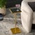 Bring elegance and sophistication into your living space with the PAKU SQUARE SIDE TABLE. Shimmering in rich gold and...