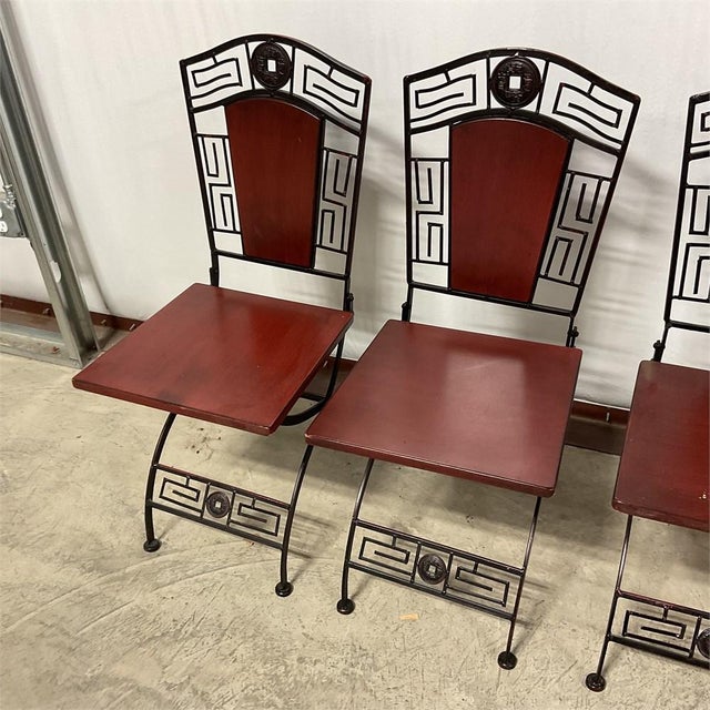 Unusual vintage Chinoiserie Ming style folding iron campaign chairs Measuring 36 " high back X 18" wide X 19" deep Chairs...