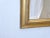 19th Century giltwood bolection mirror with rubbed goldleaf finish, 44"H x 27.5"W.