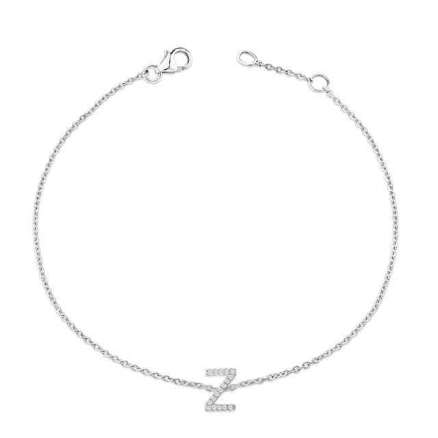 Immerse yourself in the understated elegance of this 10K white gold bracelet, rhodium-plated for an enrapturing shimmer...