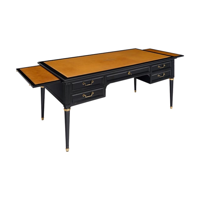 Writing desk from France in the Louis XVI style. This piece is made of solid wood construction, primarily mahogany. The...