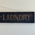 Wood Early 20th Century Antique Large "The Red ★ Laundry" Horizontal Wood Sign With Gold Whimsical Lettering & Red Star For Sale - Image 7 of 17