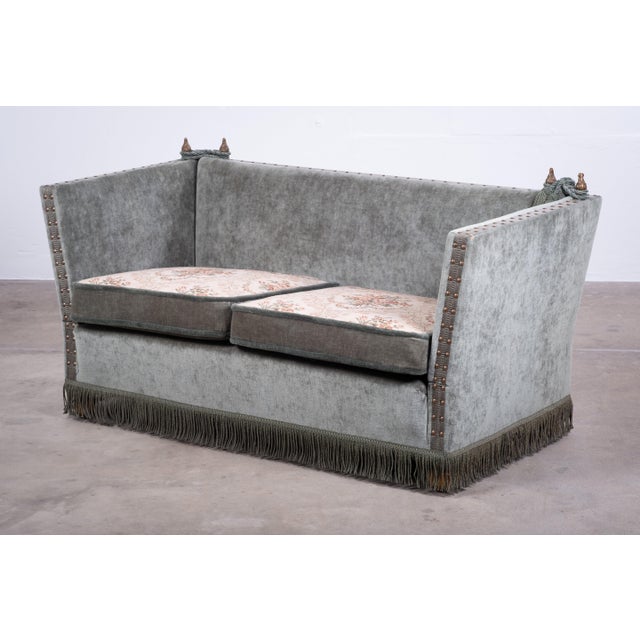 A beautiful example of the traditional Knole sofa, featuring grey/green velvet upholstery and floral-patterned, reversible...