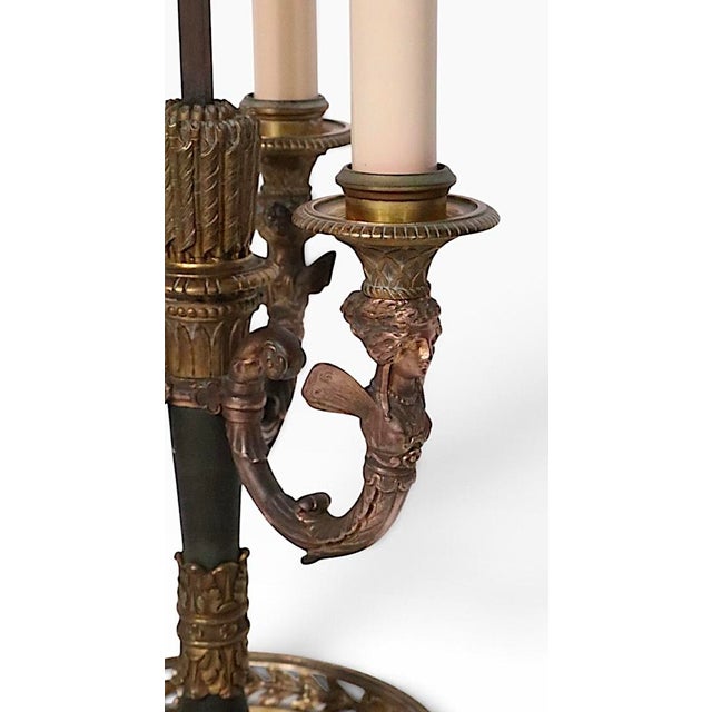 Classic French Bouillotte table lamp, in good, original, working condition. The lamp features a two tone cast brass base,...
