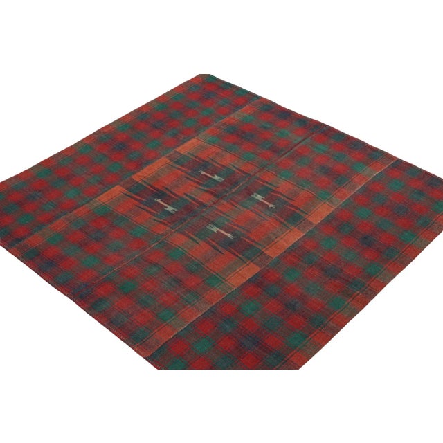 This vintage 4x6 Persian kilim is believed to be a Kurdish Jajim-style flat weave, handwoven in wool circa 1950-1960. On...