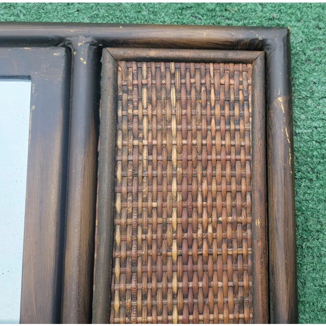 A pretty metal and wicker insert pagoda style wall mirror. The surround is made of metal with a two tone finish. The back...