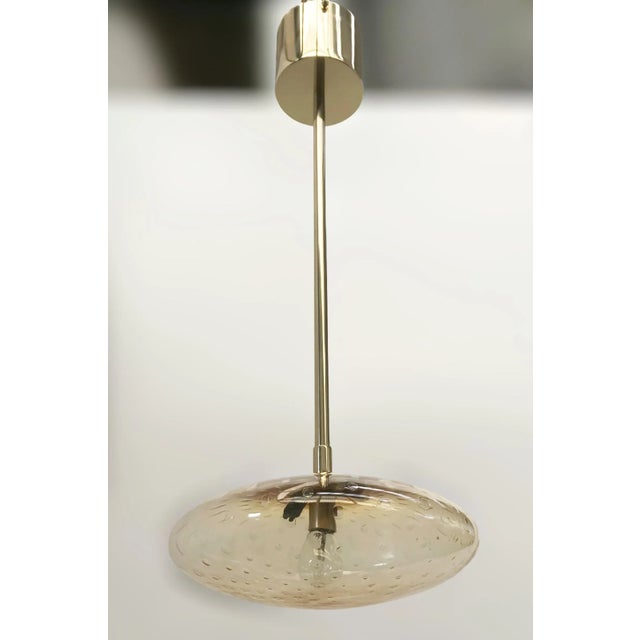 Italian pendant with amber Murano glass shade carefully hand blown with bubbles inside the glass using Bollicine...