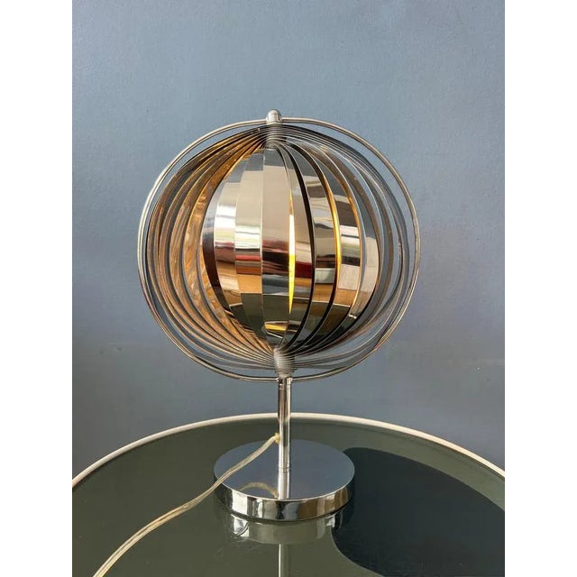 Chrome 'moon' desk lamp in the style of Henri Matthieu (remake). The light nicely spreads and beautifully reflects on the...