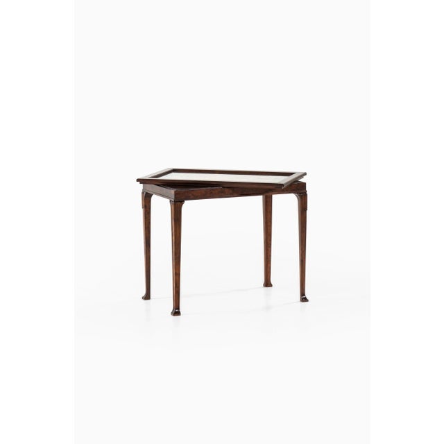 Very rare tray table designed by Eric Chambert. Produced by AB Chamberts Möbelfabrik in Norrköping, Sweden. This piece is...