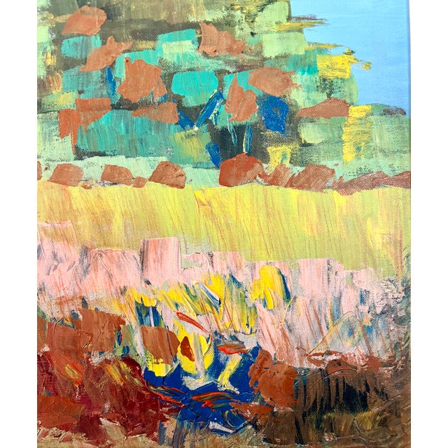 This striking Impressionistic oil painting featuring a landscape with a central tree in a field of flowers against a blue...