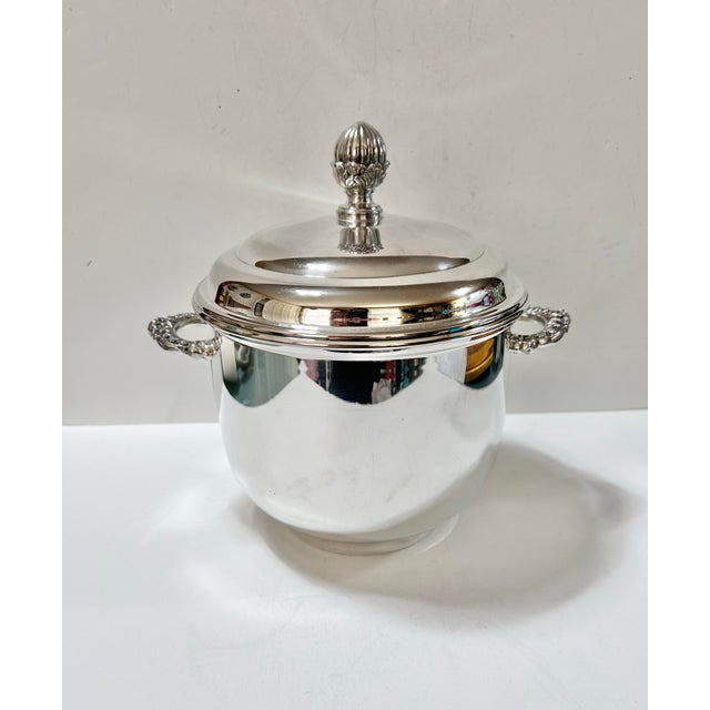 Vintage mid-century silverplate ice bucket by English Silver Mfg. Corp., made in the USA. Features a polished silver...