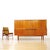 A striking Danish modern teak highboard credenza attributed to Johannes Andersen. (Denmark). Featuring an exceptionally...