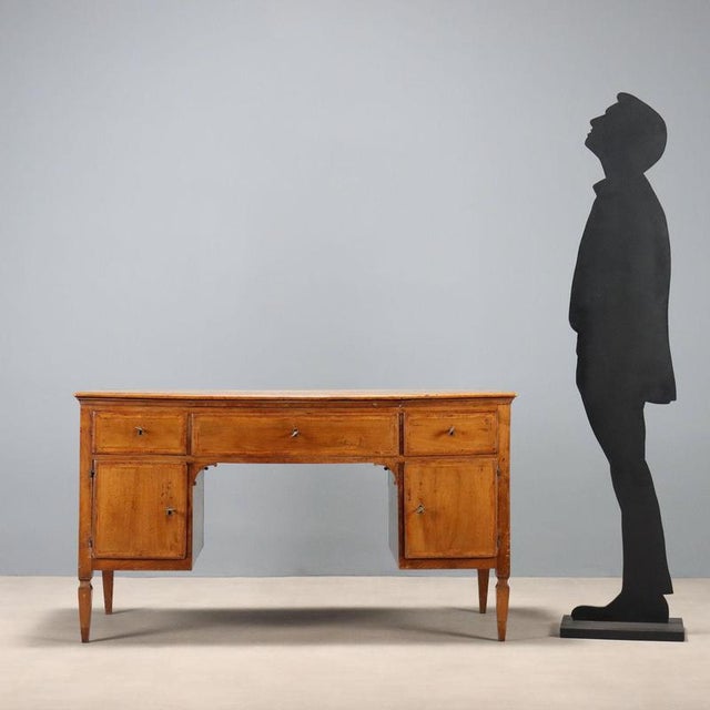 Open Directoire walnut desk with various wood trim. Central drawer in the molding under the top and drawer underneath,...