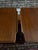 An absolutely gorgeous pair of vintage mid-century modern walnut end tables featuring elegant sculpted top edges, warm...