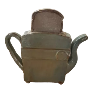 Late 20th Century Heavy Green Glazed Art Pottery Teapot Shaped Toaster With Slice of Toast Lid