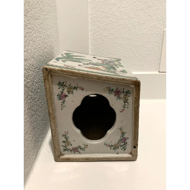 This large porcelain piece is a version of the headrests once used by well-to-do women to keep their elaborate hairstyles...