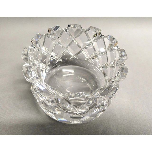 A large Orrefors cut crystal bowl from the Sofiero collection with a deep saw-tooth edge. The diamond cut bowl was...
