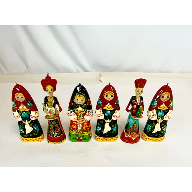 Vintage Home is pleased to offer this set of Russian Christmas Ornaments. They are both hand-carved wood and enamel...