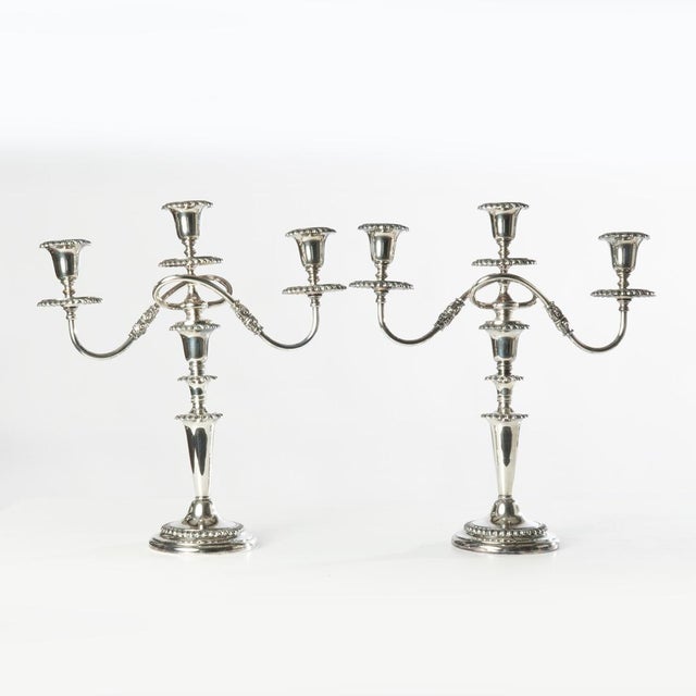 Pair of polished 3 arm silver plated candelabra made by the Friedman Silver Co. in Brooklyn, New York. Can be used as...
