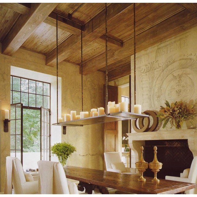 A gorgeous and iconic chandelier designed by Kevin Reilly for Holly Hunt. This custom piece features 17 hand-carved wax...