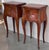 A pair of Antique French Louis XV Marquetry top nightstands. Subtle contours and scroll shapes are evident in the corner...
