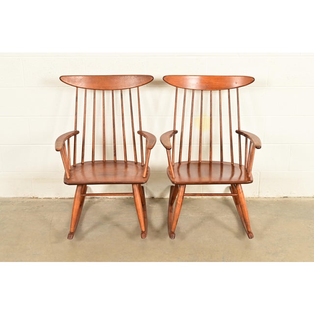 A gorgeous pair of Mid-Century Modern solid birch spindle back rocking chairs By Russel Wright for Conant Ball USA, 1950s...