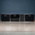 A superb four-piece sideboard consisting of three cabinets (one of which with dark smoked glass doors) and one bank of...